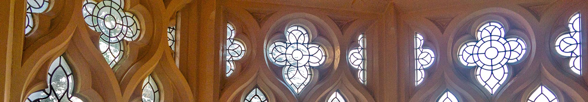 Light coming through windows in old chapel